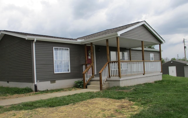 view of front of house with a porch, a shingled roof, a front yard, and crawl space
