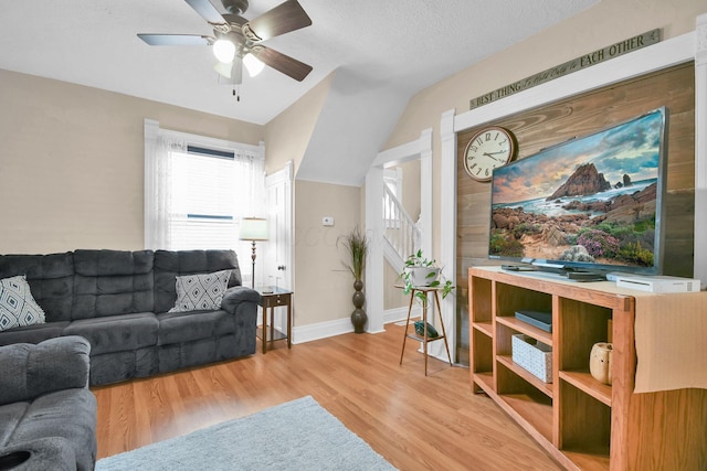54 E Smiley Ave, Shelby, OH 44875 - living area featuring a ceiling fan, baseboards, vaulted ceiling, and light wood-style flooring