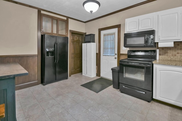 54 E Smiley Ave, Shelby, OH 44875 - kitchen with glass insert cabinets, a wainscoted wall, white cabinets, tasteful backsplash, and black appliances