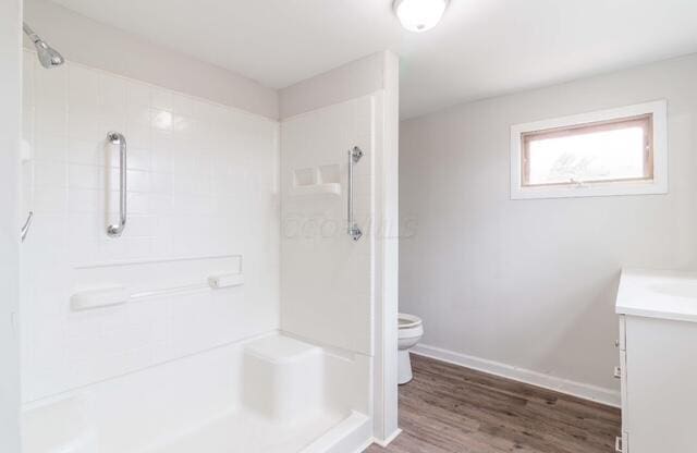 full bath with toilet, walk in shower, and vanity