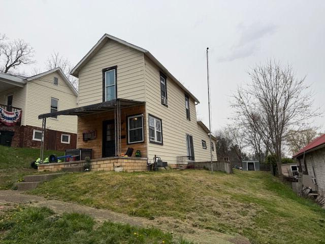 back of house with covered porch