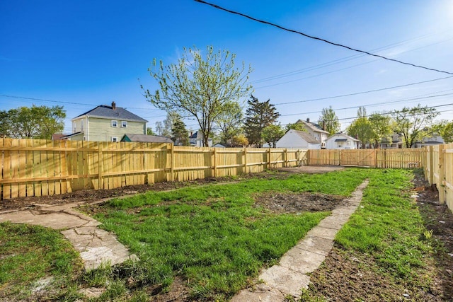 view of yard featuring a fenced backyard