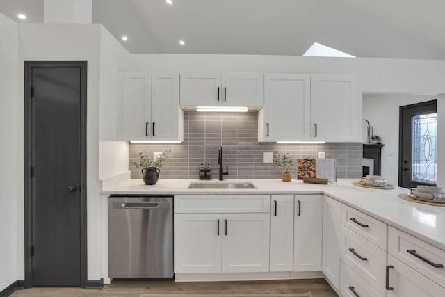 845 Mcnaughten Rd, Columbus, OH 43213 - kitchen featuring white cabinets, decorative backsplash, a sink, and dishwasher