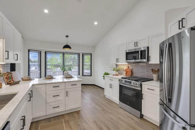 845 Mcnaughten Rd, Columbus, OH 43213 - kitchen with backsplash, appliances with stainless steel finishes, light stone counters, white cabinets, and recessed lighting