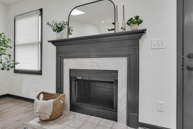 845 Mcnaughten Rd, Columbus, OH 43213 - details with baseboards, wood finished floors, and a fireplace