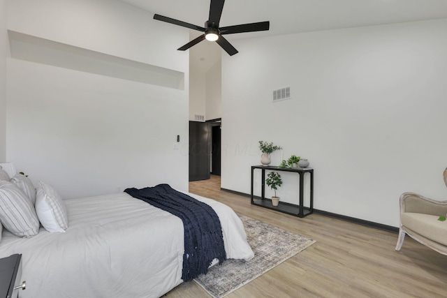 845 Mcnaughten Rd, Columbus, OH 43213 - bedroom with a ceiling fan, visible vents, high vaulted ceiling, baseboards, and light wood finished floors