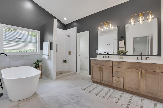 845 Mcnaughten Rd, Columbus, OH 43213 - bathroom featuring double vanity, walk in shower, a sink, and marble finish floor