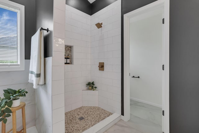 845 Mcnaughten Rd, Columbus, OH 43213 - bathroom featuring marble finish floor and a tile shower