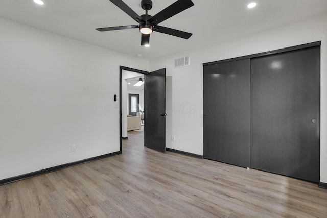 845 Mcnaughten Rd, Columbus, OH 43213 - unfurnished bedroom featuring visible vents, baseboards, a closet, light wood finished floors, and recessed lighting