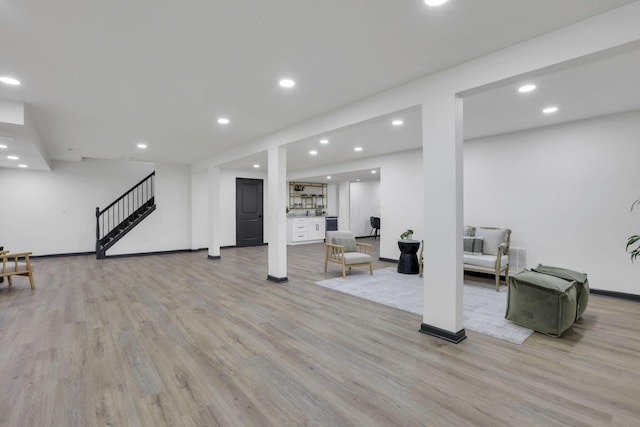 845 Mcnaughten Rd, Columbus, OH 43213 - finished below grade area featuring light wood-style floors, recessed lighting, baseboards, and stairway