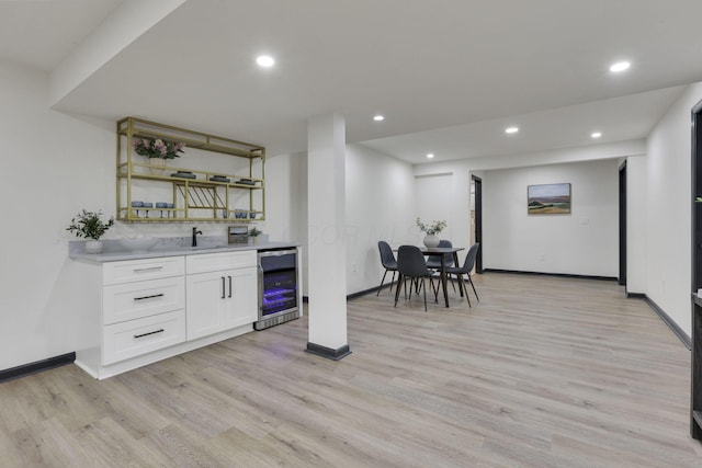 845 Mcnaughten Rd, Columbus, OH 43213 - bar featuring indoor wet bar, light wood-style flooring, and beverage cooler