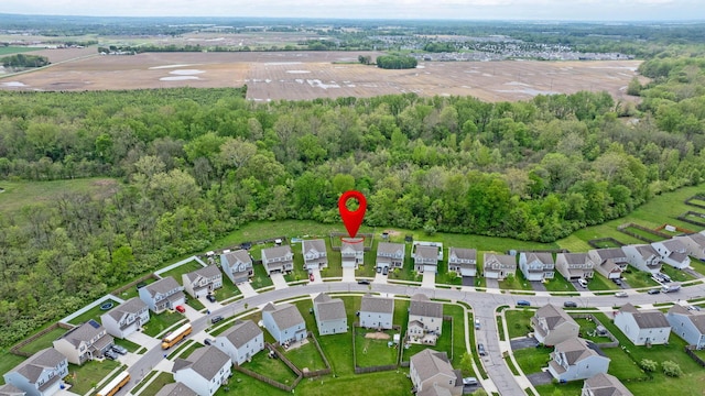5837 Mouzon Dr, Columbus, OH 43232 - drone / aerial view featuring a wooded view and a residential view