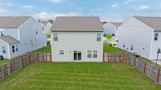 5837 Mouzon Dr, Columbus, OH 43232 - back of property with a yard, a gate, a residential view, and a fenced backyard