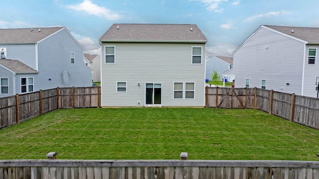 5837 Mouzon Dr, Columbus, OH 43232 - rear view of house featuring a fenced backyard, a residential view, and a lawn