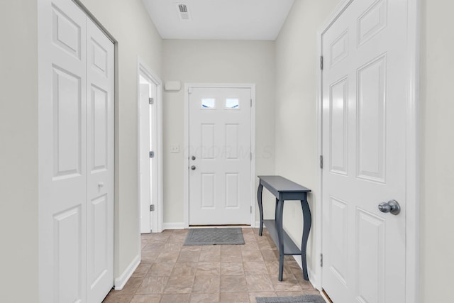 5837 Mouzon Dr, Columbus, OH 43232 - entryway featuring baseboards, stone finish floor, and visible vents