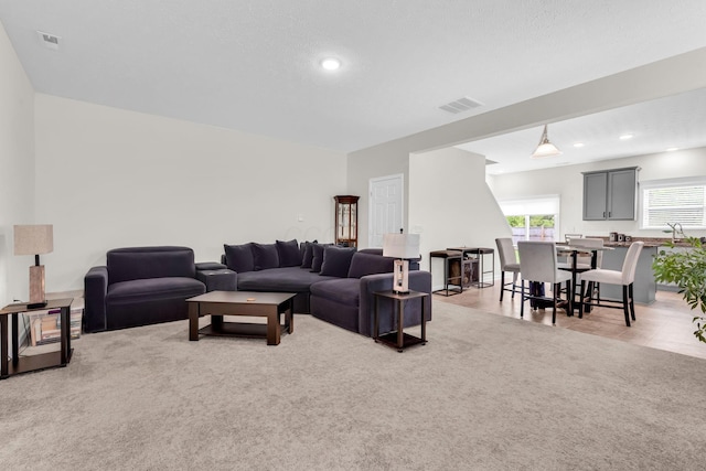5837 Mouzon Dr, Columbus, OH 43232 - living area featuring light colored carpet, visible vents, and recessed lighting