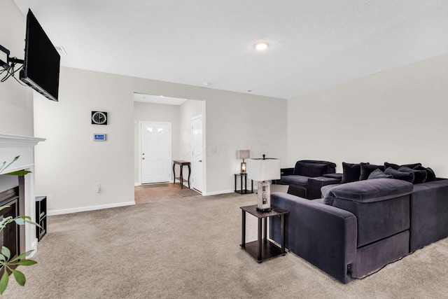 5837 Mouzon Dr, Columbus, OH 43232 - living area with carpet, baseboards, and a glass covered fireplace