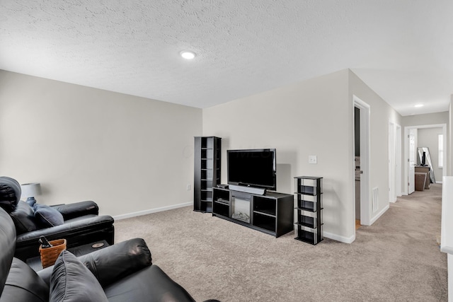 5837 Mouzon Dr, Columbus, OH 43232 - living room featuring light colored carpet, a textured ceiling, and baseboards