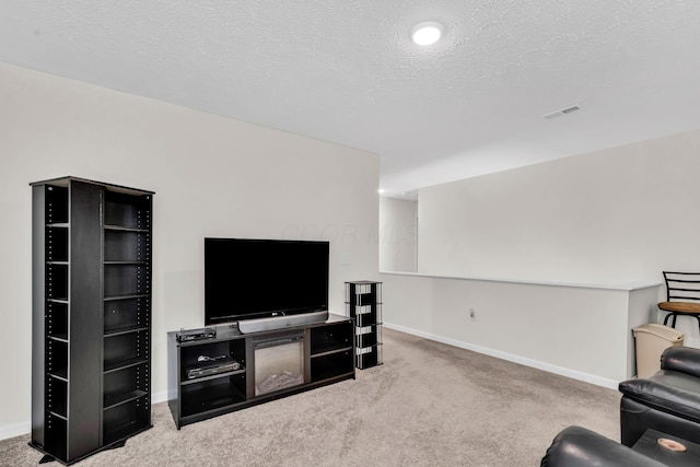5837 Mouzon Dr, Columbus, OH 43232 - living area featuring a textured ceiling, carpet, baseboards, and visible vents