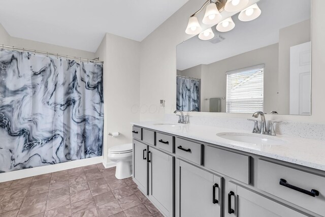 5837 Mouzon Dr, Columbus, OH 43232 - full bathroom featuring a sink, double vanity, toilet, and a shower with shower curtain
