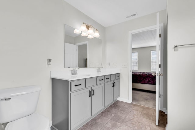 5837 Mouzon Dr, Columbus, OH 43232 - bathroom with toilet, ensuite bathroom, visible vents, and a sink