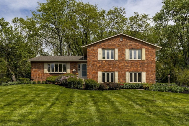 4522 Crompton Dr, Columbus, OH 43220 - tri-level home with brick siding and a front lawn