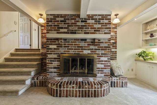 4522 Crompton Dr, Columbus, OH 43220 - carpeted living area with a fireplace, beamed ceiling, and stairs