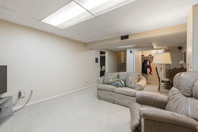 4522 Crompton Dr, Columbus, OH 43220 - carpeted living room with baseboards, stairway, and a paneled ceiling