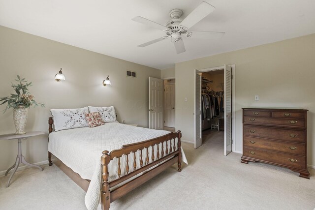 4522 Crompton Dr, Columbus, OH 43220 - bedroom featuring light colored carpet, baseboards, and a walk in closet