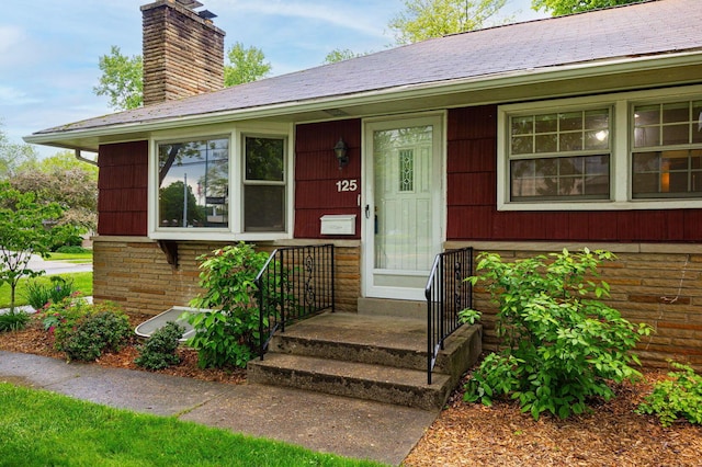 125 S Hamilton Rd, Columbus, OH 43230 - view of exterior entry featuring a chimney