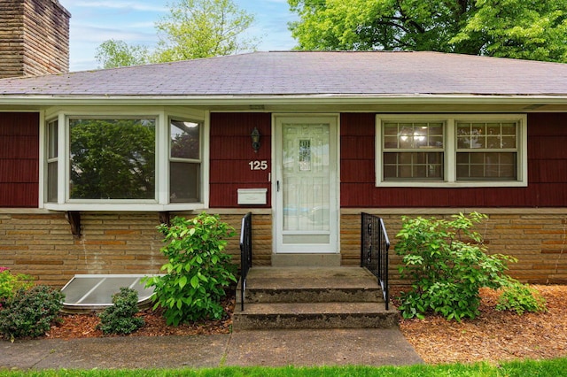 125 S Hamilton Rd, Columbus, OH 43230 - view of front of property featuring a chimney, brick siding, and a shingled roof