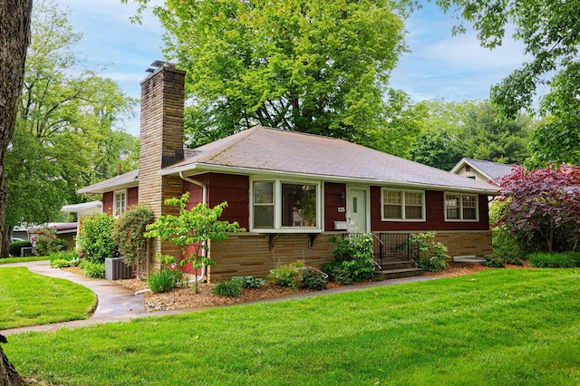 125 S Hamilton Rd, Columbus, OH 43230 - view of front facade with a chimney, a front yard, and central AC