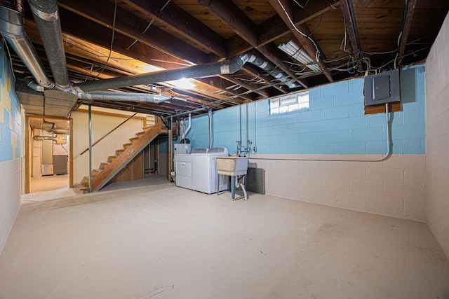 125 S Hamilton Rd, Columbus, OH 43230 - basement featuring washing machine and dryer, electric panel, stairs, and a sink