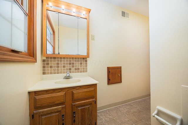 125 S Hamilton Rd, Columbus, OH 43230 - bathroom with tasteful backsplash, vanity, and baseboards