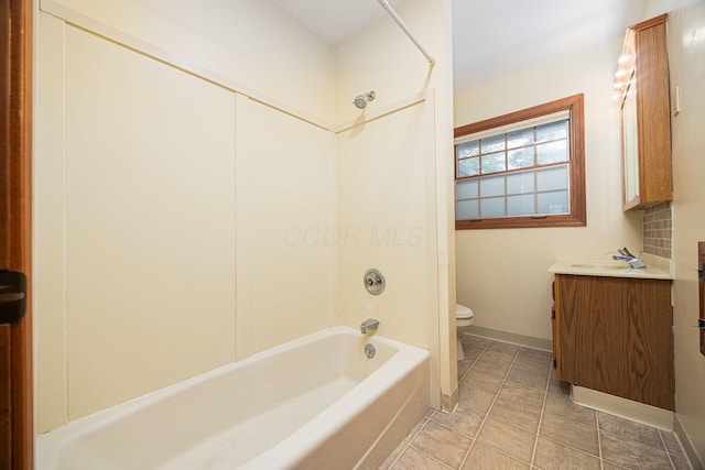 125 S Hamilton Rd, Columbus, OH 43230 - bathroom featuring toilet, vanity,  shower combination, baseboards, and tile patterned floors
