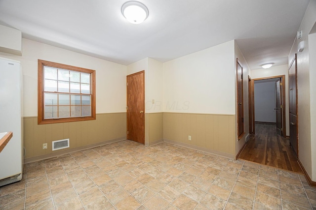 125 S Hamilton Rd, Columbus, OH 43230 - empty room featuring wainscoting and stone finish floors
