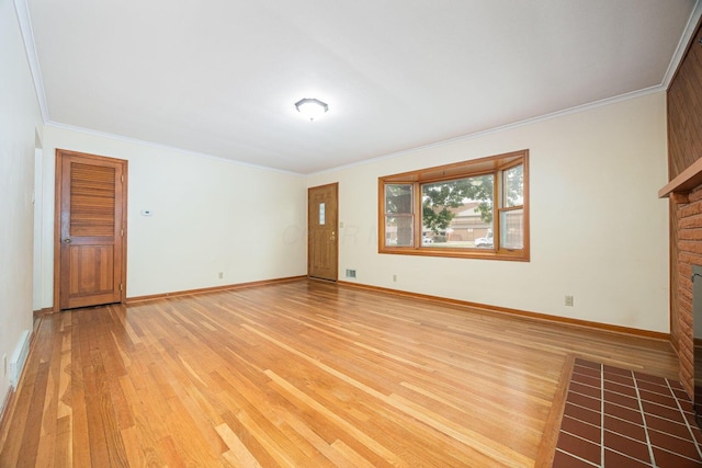 125 S Hamilton Rd, Columbus, OH 43230 - unfurnished living room featuring light wood-type flooring, crown molding, a fireplace, and baseboards
