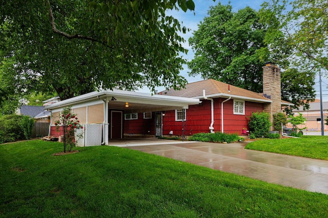 125 S Hamilton Rd, Columbus, OH 43230 - view of front of property featuring driveway, a chimney, and an attached carport