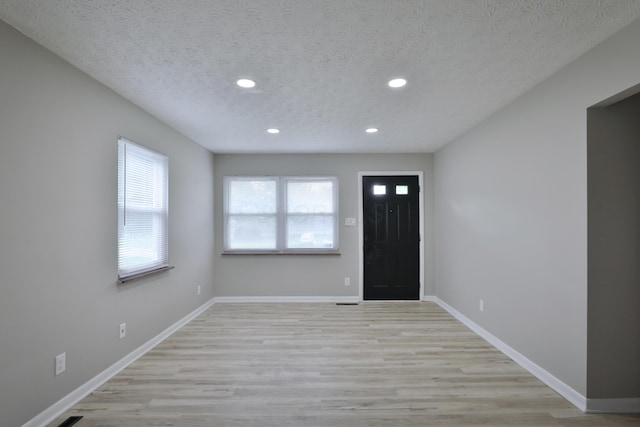 1235 Beechwood Rd, Columbus, OH 43227 - entrance foyer with recessed lighting, a textured ceiling, and light wood-style floors