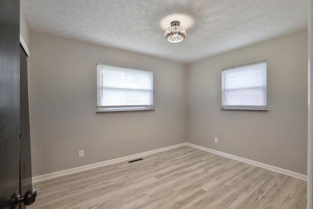 1235 Beechwood Rd, Columbus, OH 43227 - unfurnished bedroom featuring wood finished floors and a textured ceiling