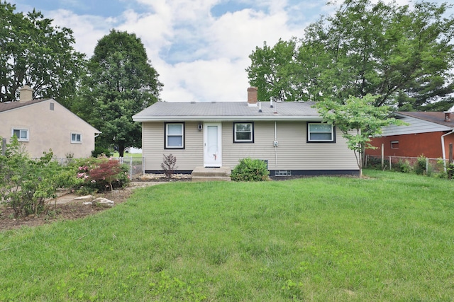 1235 Beechwood Rd, Columbus, OH 43227 - rear view of property featuring a chimney
