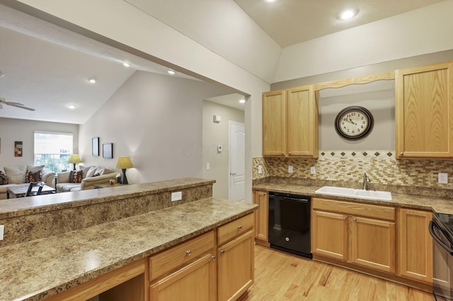 kitchen with a sink, light wood-style flooring, backsplash, black appliances, and vaulted ceiling