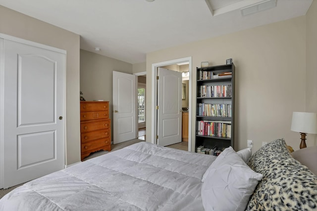 carpeted bedroom with visible vents
