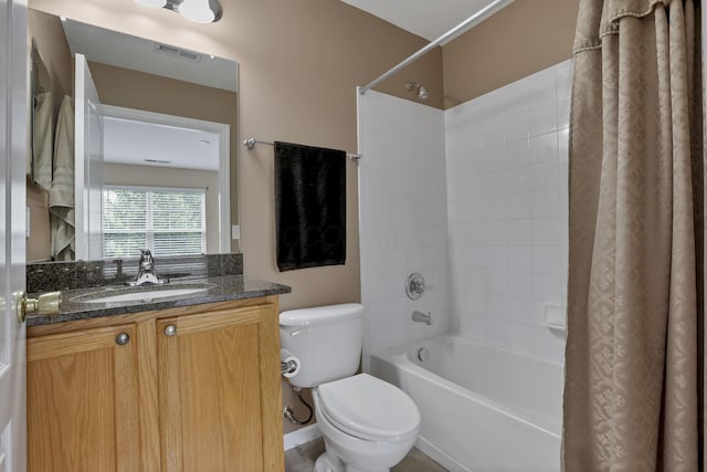 full bathroom featuring shower / tub combo, vanity, toilet, and visible vents