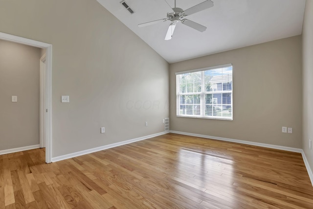 unfurnished room with a ceiling fan, visible vents, baseboards, high vaulted ceiling, and light wood finished floors