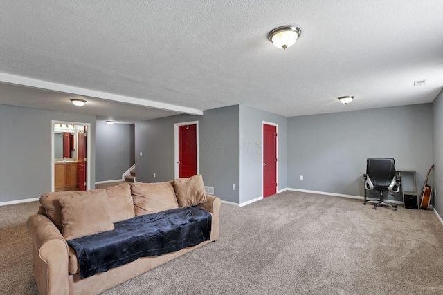 carpeted living area with baseboards, a textured ceiling, stairs, and visible vents