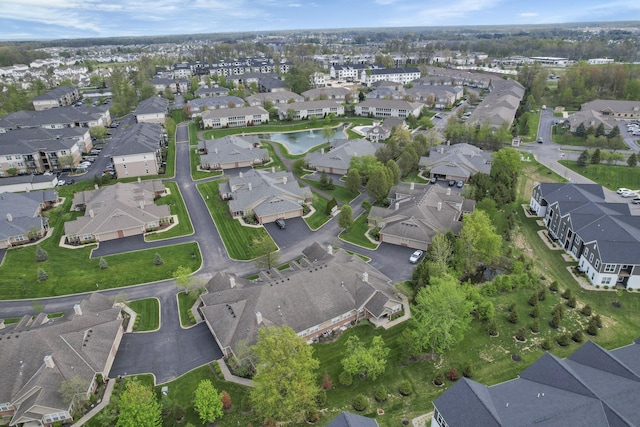 aerial view featuring a water view and a residential view