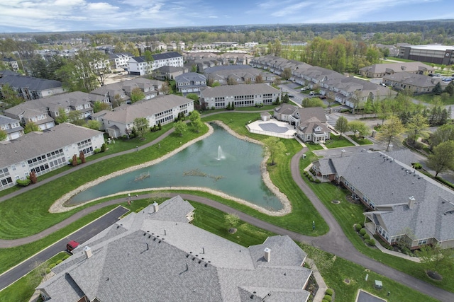 birds eye view of property with a water view and a residential view