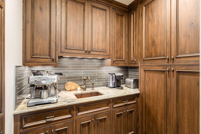 interior space featuring a sink, decorative backsplash, and a toaster