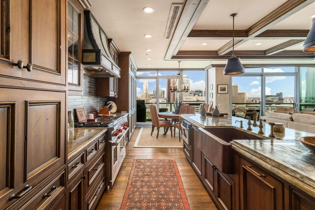 1 Miranova Pl Unit 2230, Columbus, OH 43215 - kitchen featuring a view of city, a sink, dark wood-style flooring, and double oven range